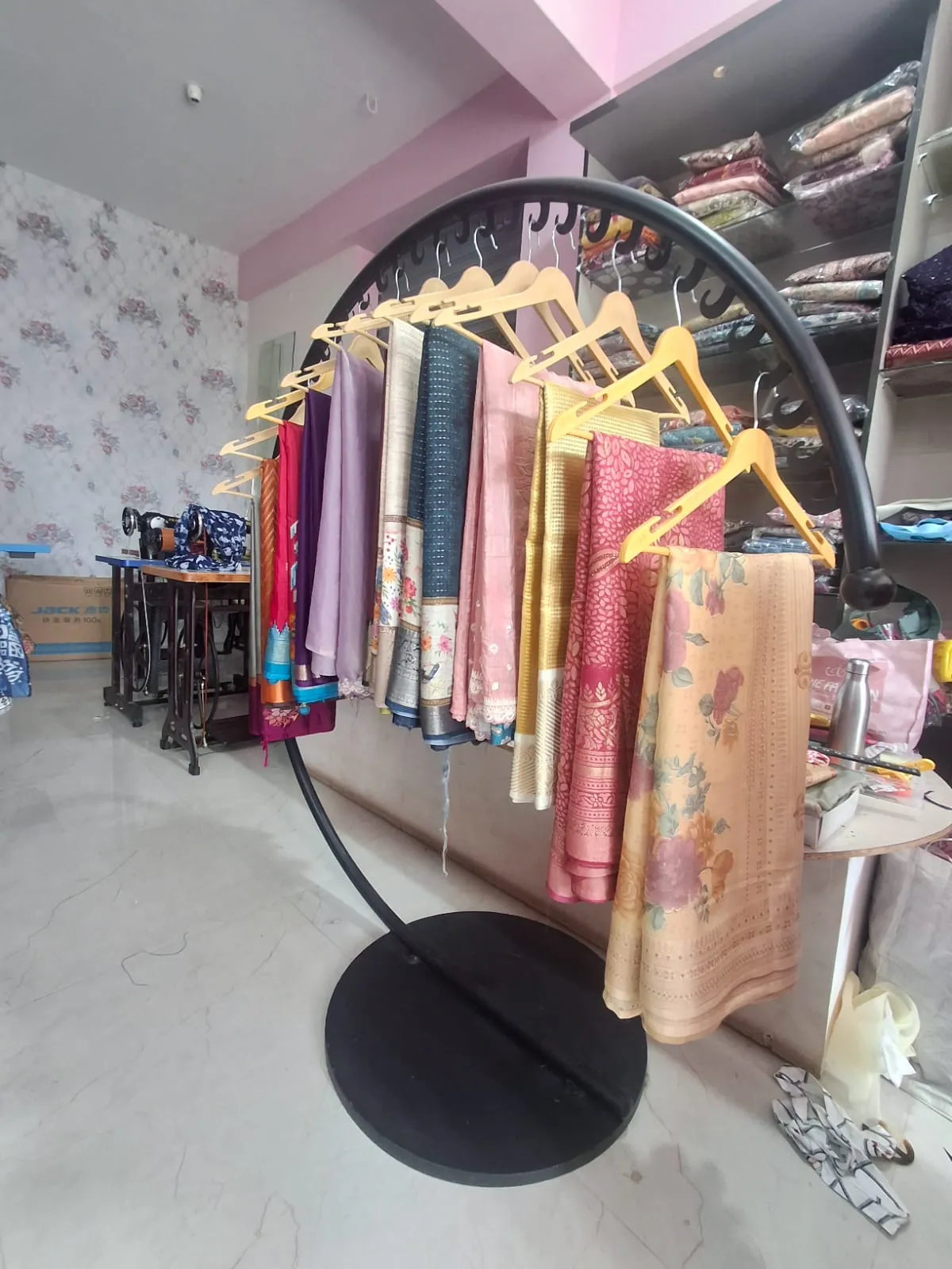 Elegant interior of Sri Sai Boutique in Chikkamagaluru with stylish clothing displays